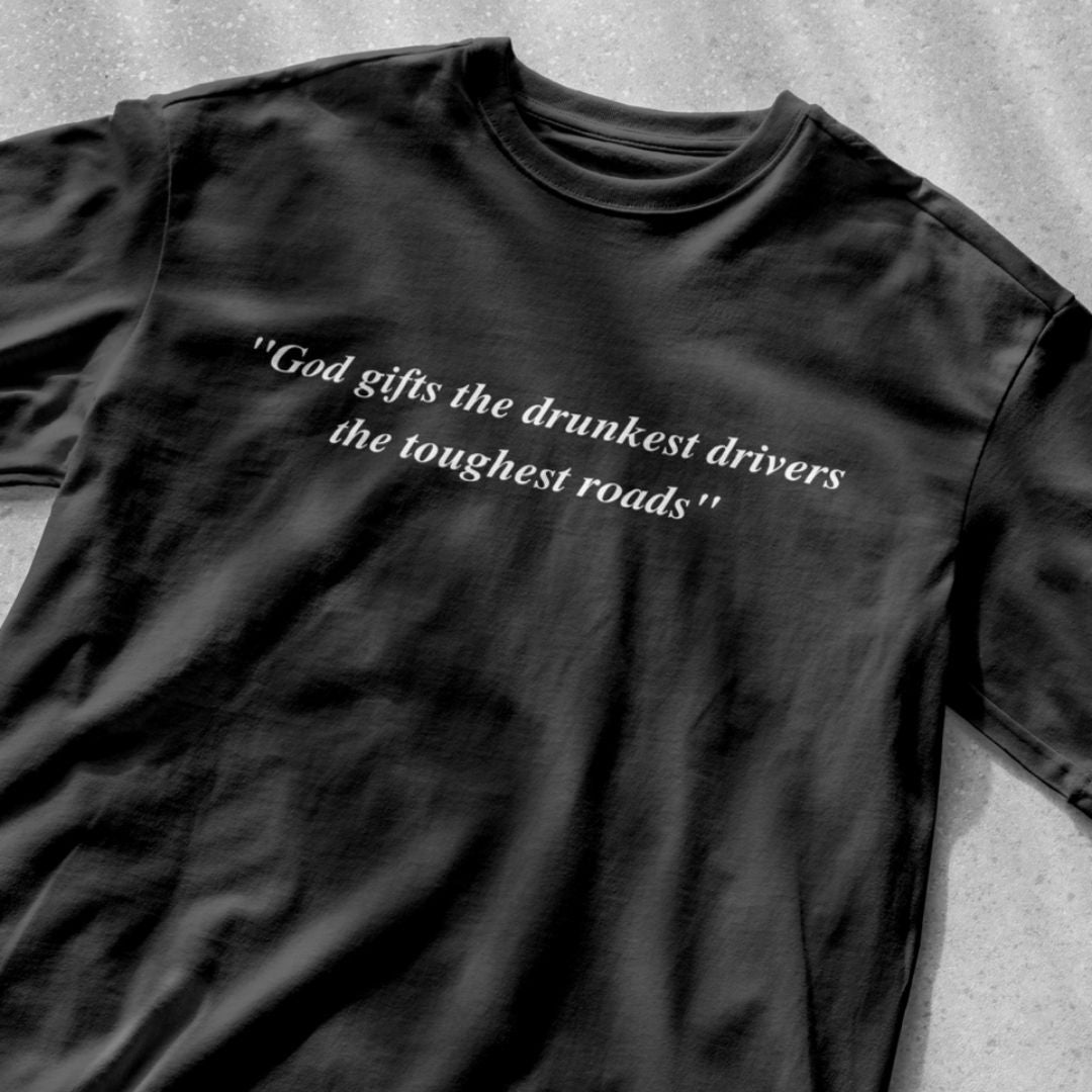 God gifts the drunkest drivers the toughest roads" - Unisex Heavy Cotton Tee - All Colors